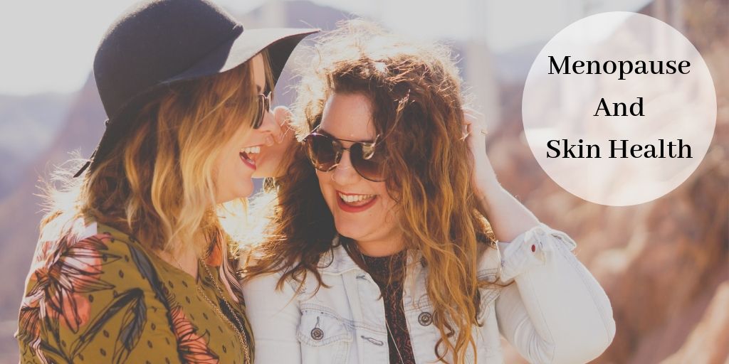 2 women with sunglasses laughing